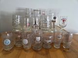 a lot of glasses sitting on a wooden table