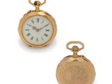 pair of gold plated pocket watches with roman numerals and roman numerals