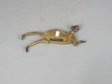 an antique brass figurine of a horse with a saddle on its back