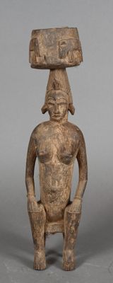 an image of a statue of a man with a large head on his head