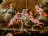 a painting of angels on the ceiling of a building