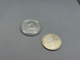 two coins sitting next to each other on a table