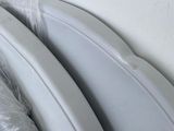 two pieces of plastic wrapped up on the back of a car
