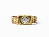 an image of a close up of a gold watch on a white background