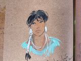 a drawing of a native american woman on a piece of brown paper