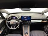 the interior of a car with a steering wheel, dashboard, and display screen