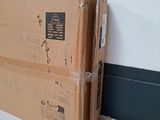 two boxes stacked on top of each other on the floor