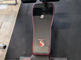 a machine that is sitting on the floor in the gym