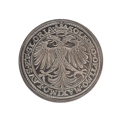 une image représentant une pièce d'argent sur laquelle figure un aigle