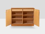 a close up of a wooden cabinet with open doors