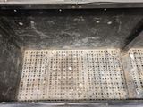 a metal grate with holes and holes in it