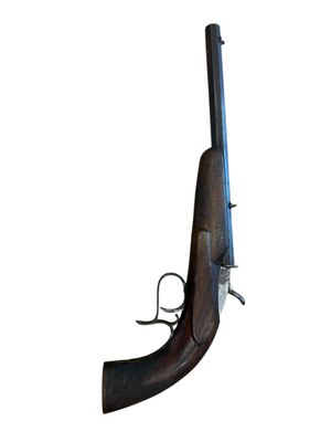 an old gun with a wooden handle on a white background