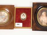 two framed pictures of a woman and a child in a wooden box