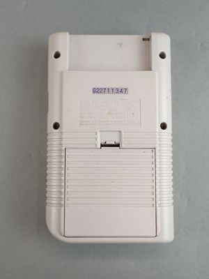 a white nintendo game console sitting on a table