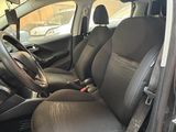 the interior of a car with black leather seats and a steering wheel