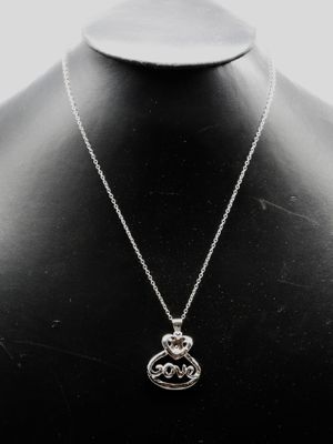 a close up of a necklace on a mannequin mannequin