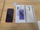a box with a phone inside of it on a table