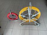 a yellow and red hose sitting on the floor next to a red and yellow hose