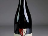 a bottle of wine that is sitting on a table