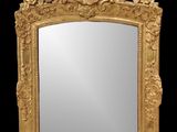 une image représentant un miroir à cadre doré sur fond noir