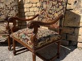pair of antique upholstered chairs with floral upholstered cushions