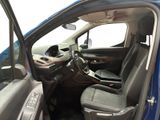 the interior of a car with the door open and the driver ' s seat down