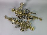 a bunch of brass flowers on a white surface