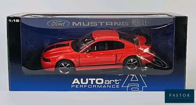 the red toy car is in the box on the table