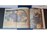 an open book with a map of the world on it