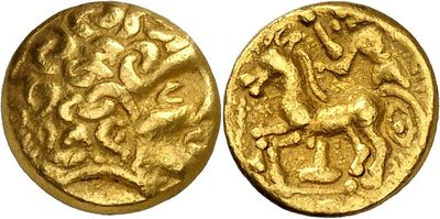 a gold coin with a picture of a horse on it