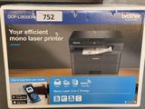 a box of a printer sitting on top of a wooden table