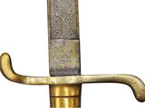 a gold colored sword with a black handle on a white background