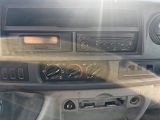 a car dashboard with a radio and other controls