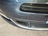 a close up of a car ' s bumper with a sticker on it