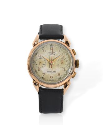 une image représentant une montre dorée et noire sur fond blanc