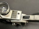 an old camera that is sitting on a table