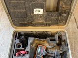 a tool in a case that is sitting on the floor