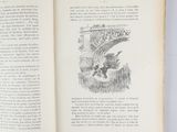 an open book with a drawing of a bird on it