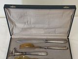 a silverware set in a case with a spoon and fork