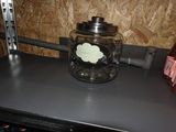 a glass jar with a label on it sitting on a counter