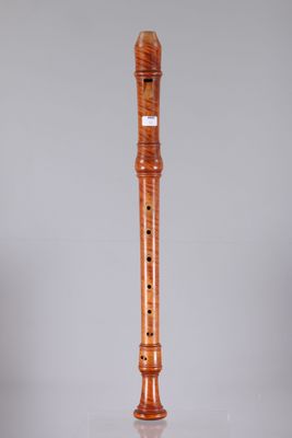the flute is made of wood and has a wooden body