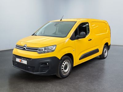 a yellow van parked in a room with a black floor