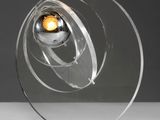 a close up of a glass sculpture with a light inside of it