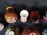 many different types of bowls and cups on the table