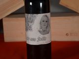 a bottle of wine with a picture of a woman on it