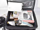 a black suitcase with a bunch of items inside of it