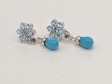 boucles d'oreilles en forme de fleurs turquoise ornées de cristaux Swarovski et de pierres précieuses