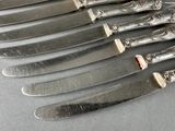 six knives that are on top of each other