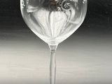 a wine glass that is sitting on a table