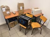 a pile of boxes and a printer on a desk